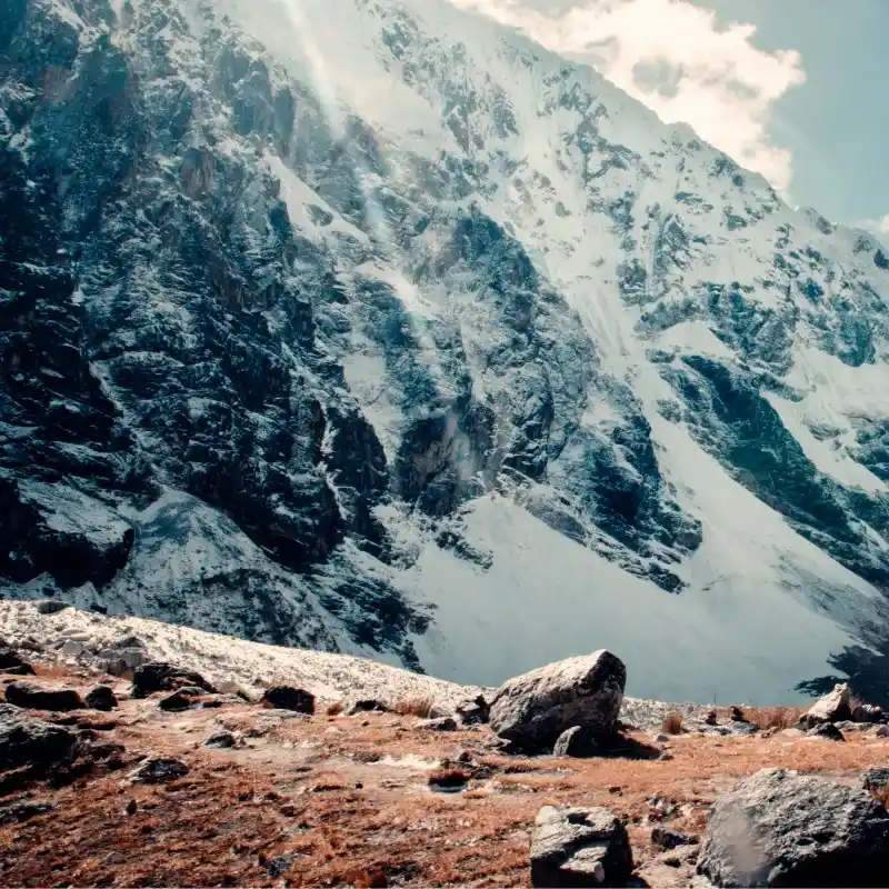 igh mountain trail on the Salkantay trek surrounded by glaciers and Andean landscapes