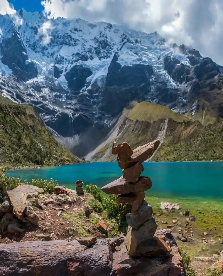 Hikers visiting Humantay Lagoon during the 3-day Salkantay trek to Machu Picchu